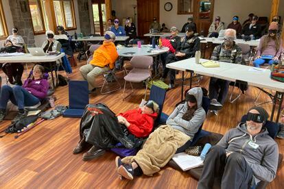 Psilocybin facilitator students sit with eye masks on while listening to music during an experiential activity at a training session run by InnerTrek near Damascus, Ore., on Dec. 2, 2022.