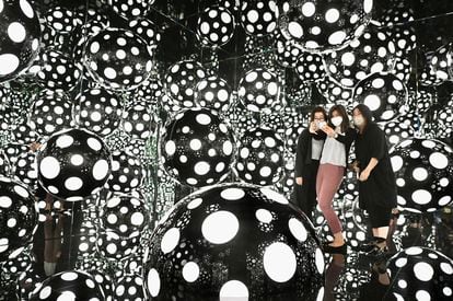 Visitors photograph themselves in a Yayoi Kusama installation at the M+ museum in Hong Kong last November.