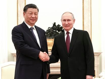 In this handout photo released by Russian Presidential Press Office, President Vladimir Putin and President Xi Jinping shake hands prior to their talks at the Kremlin in Moscow, Russia, on March 20, 2023.