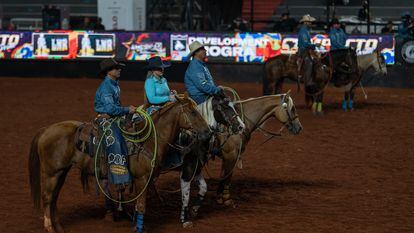 Five ranchers appear before the public at the Barretos Rodeo Festival, before the competition begins.