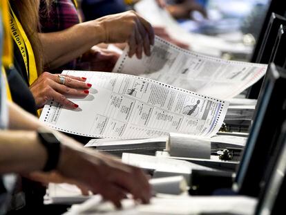 Election workers perform a recount of ballots from the recent Pennsylvania primary election at the Allegheny County Election Division warehouse in Pittsburgh on June 1, 2022.