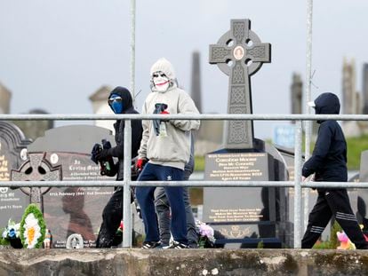 Masked youth with petrol bombs are seen as Republican protesters opposed to the Good Friday Agreement parade in Londonderry, Northern Ireland, Monday, April 10, 2023