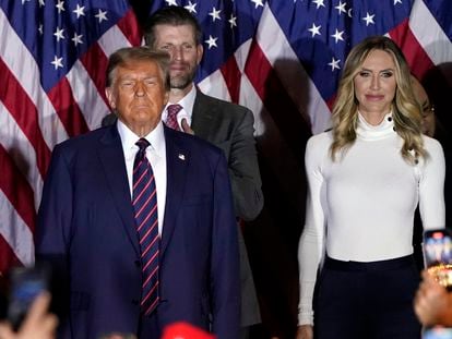 Republican presidential candidate Donald Trump arrives to speak at a primary election night party in Nashua, N.H., Tuesday, Jan. 23, 2024, with Eric and Lara Trump.