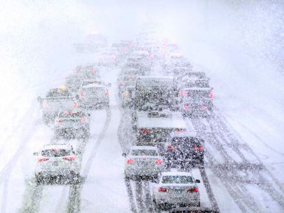 Traffic is stopped due to snowy weather conditions on Route 93 South, Tuesday, March 14, 2023, in Londonderry, N.H. (AP Photo/Charles Krupa)