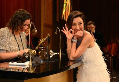 Michelle Yeoh waits for her statuette to be personalized at the Governor's Ball this Sunday in Los Angeles.