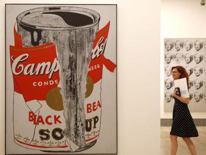 A visitor next to Warhol’s ‘Big Torn Campbell's Soup Can.’