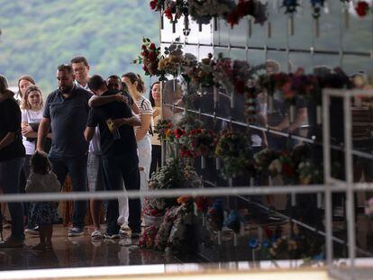 Relatives of one of the victims attend the funeral at the Sao Jose Cemetery, city of Blumenau, Santa Catarina State, in southern Brazil, on April 6, 2023.