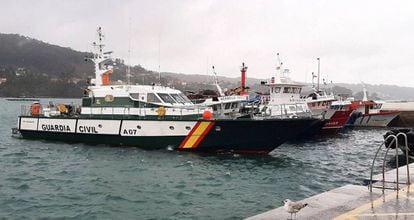 Civil Guard boats in the port of Aldán, where the sub was towed.