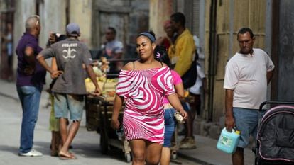 A woman walks in downtown Havana.