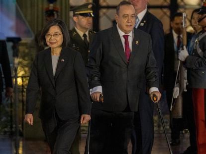 Taiwan's President Tsai Ing-wen, left, and Guatemala's President Alejandro Giammattei, walk to deliver a joint statement at the National Palace in Guatemala City, Friday,