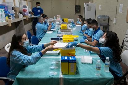 Covid-19 vaccines are prepared at a vaccination point in Seville, southern Spain.