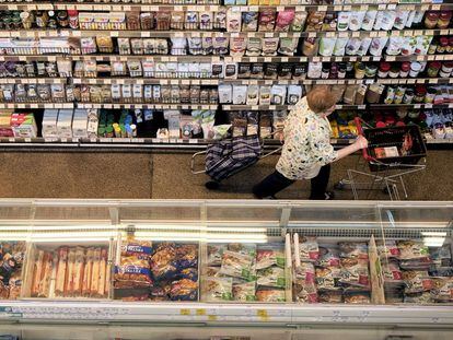 A customer shops at a supermarket in Warsaw, Poland, on Aug. 16.