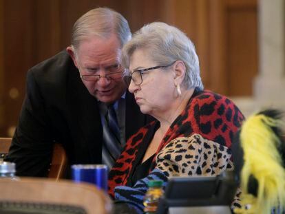 Kansas House Speaker Dan Hawkins confers with state Representative Brenda Landwehr ahead of a House debate on March 21, 2023, at the Statehouse in Topeka, Kansas.