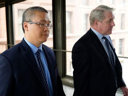 Former Minneapolis police officer Tou Thao, left, and his attorney arrive for sentencing for violating George Floyd's civil rights outside the Federal Courthouse, July 27, 2022, in St. Paul, Minnesota.