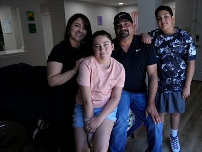 Mayah Zamora, second from left, a survivor of the mass shooting at Robb Elementary in Uvalde, Texas, poses for a photo with her mom Christina, left, dad Ruben, and brother Zach, right, at their home in San Antonio, Tuesday, June 27, 2023.