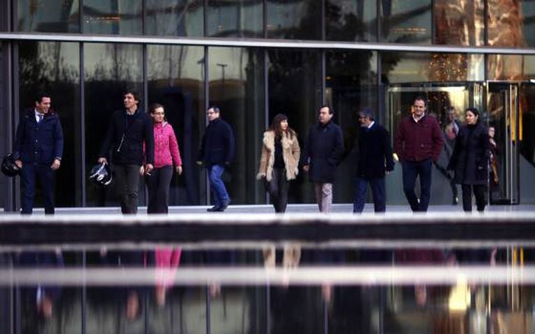 Employees leave work in the early afternoon at Iberdrola in Madrid.
