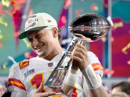 Kansas City Chiefs quarterback Patrick Mahomes (15) holds the trophy after their win against the Philadelphia Eagles in the NFL Super Bowl LVII.