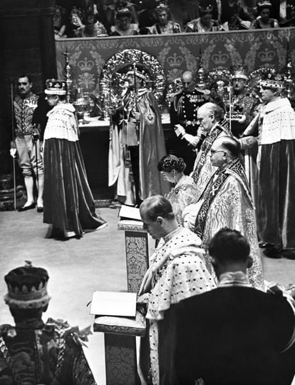 The Queen and the Duke of Edinburgh kneeling side by side in front of the Altar for the Communion in Westminster Abbey after the Crowning and Homage Ceremonies.  