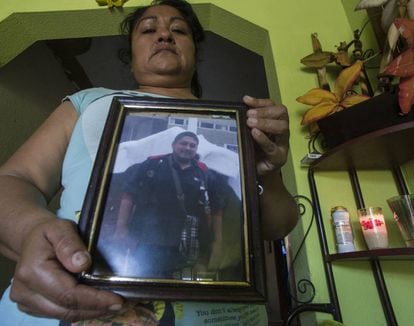 Blandina Ponce with a photograph of her son, who she says was murdered by police in Villa Juárez. Sinaloa.