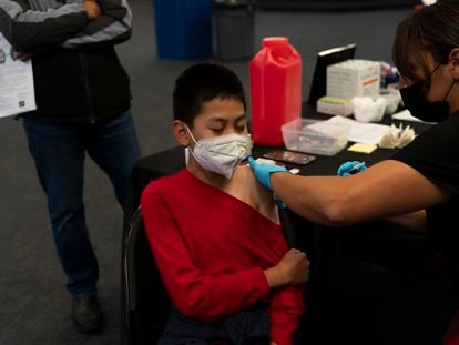 Johnny Thai, 11, receives the Pfizer COVID-19 vaccine at a pediatric vaccine clinic for children ages 5 to 11 set up at Willard Intermediate School in Santa Ana, Calif., Nov. 9, 2021.