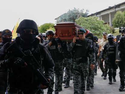 Police escort the coffin of the candidate Fernando Villavicencio in Quito, Ecuador, in 2023.