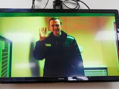 Alexei Navalny is seen on a TV screen, as he appears in a video link provided by the Russian Federal Penitentiary Service in a courtroom of the Basmanny Court in Moscow, Russia, on April 26, 2023.