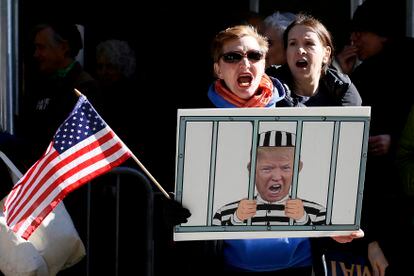Anti-Trump demonstrators protest outside the Manhattan District Attorney's office in New York City on March 21, 2023.