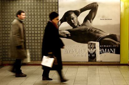 David Beckham, in his Armani underwear, in the Milan subway.