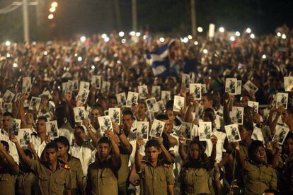 Military cadets hold up pictures of Fidel Castro at the Tuesday tribute.