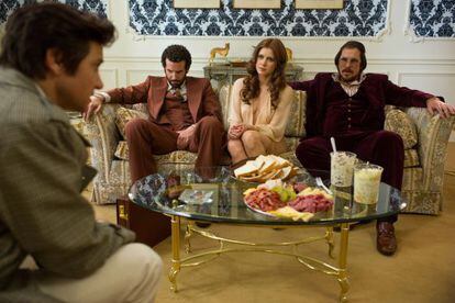 From left: Jeremy Renner, Bradley Cooper, Amy Adams and Christian Bale in American Hustle.