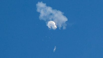 The suspected Chinese spy balloon drifts to the ocean after being shot down off the coast in Surfside Beach, South Carolina, February 4, 2023.