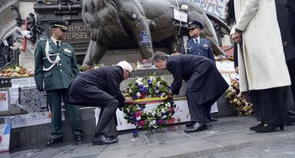 Santos (right) at a ceremony to pay tribute to victims of terrorism in Paris.