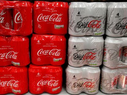 Multi can packs of Coca Cola and Diet Coke are seen for sale in a motorway services shop in January 2019.