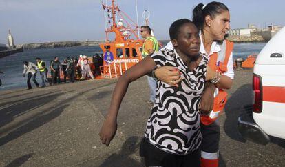 A would-be immigrant is helped ashore at the port of Tarifa, southern Spain, this week.