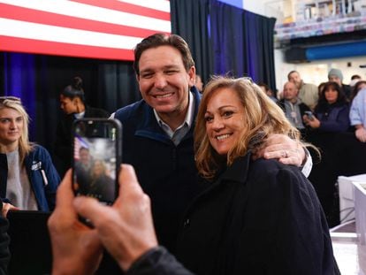 Ron DeSantis stands with a supporter on January 20 in Myrtle Beach, South Carolina, at one of his final campaign events.