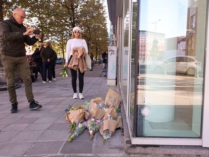 Flowers are put in place at the bank branch, where two football supporters from Sweden were shot dead in a terror attack in Brussels, Belgium, 17 October 2023.
