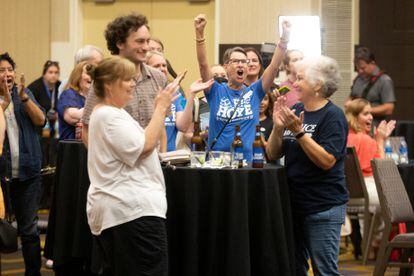 Abortion rights advocates celebrate the first favorable results for their cause in Topeka.