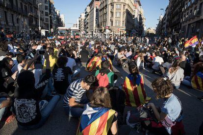 Protesters block off traffic in Universitat square in the center of Barcelona.