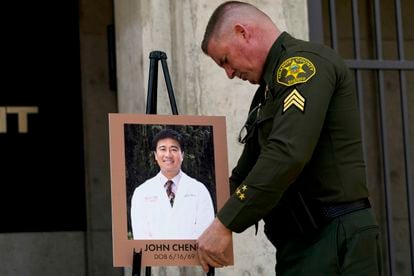 The sheriff of Orange County, Scott Steinle, with a photograph of John Cheng.