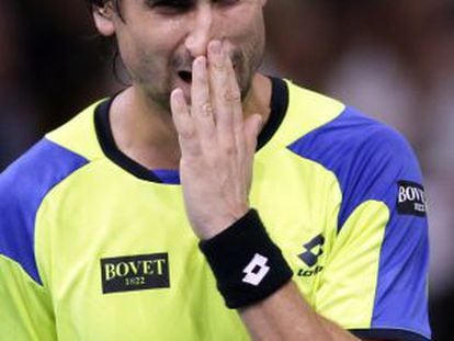 Spain's David Ferrer reacts after a point against Serbia's Novak Djokovic.