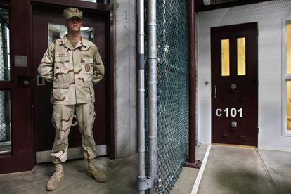 A guard watches an entrance to the security center at Camp 6, Guantánamo Bay.