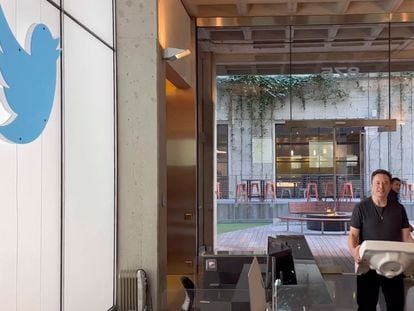 This image from the Twitter page of Elon Musk shows Musk entering Twitter headquarters carrying a sink through the lobby area on Wednesday, Oct. 26, 2022 in San Francisco.
