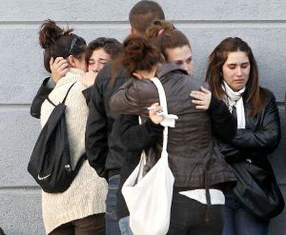 Friends of Katia Esteban comfort each other after learning of her death.