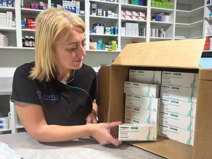 A pharmacist shows boxes of the Danish drug last week in Glasgow.