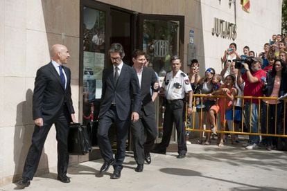 Messi leaves court after appearing before a judge over tax fraud allegations in September 2013.