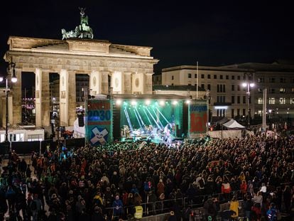 Secretary-General at the German Advisory Council on Global Change (WBGU), Maja Goepel (R), speaks during a rally and a concert on the occasion of the upcoming referendum on climate neutrality in front of the Brandenburg Gate in Berlin, Germany, 25 March 2023.
