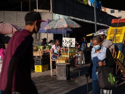 Venezuelans shop at an open-air market in Caracas.