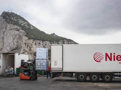Spanish workers drop off goods near Gibraltar airport.