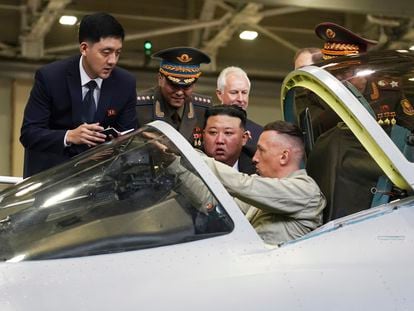 In this photo released by the Khabarovsky Krai region government, North Korean leader Kim Jong Un, center, looks at a military jet cockpit while visiting a Russian aircraft plant that builds fighter jets in Komsomolsk-on-Amur, about 6,200 kilometers (3,900 miles) east of Moscow, Russia, Friday, Sept. 15, 2023.