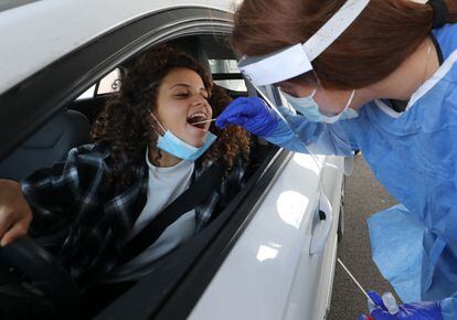 A woman takes a coronavirus test in the Israeli city of Modi'ín.